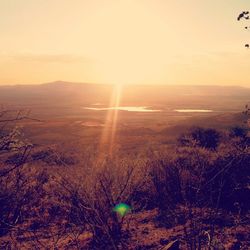 Scenic view of landscape against sky during sunset