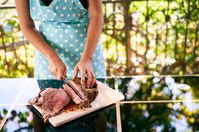 Midsection of woman holding food