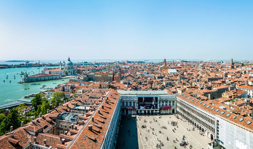 High angle view of cityscape against clear blue sky