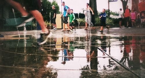 Reflection of people in water