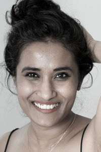 Close-up portrait of a smiling young woman