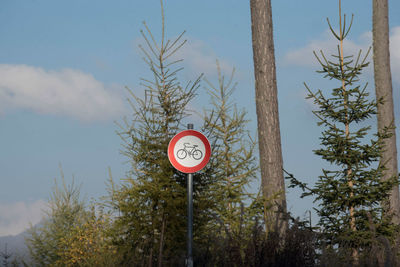 Low angle view of road sign against sky