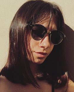 Close-up portrait of woman with sunglasses