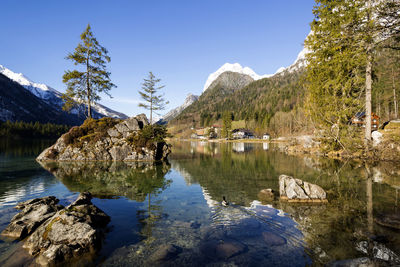 Scenic view of lake and mountains against sky