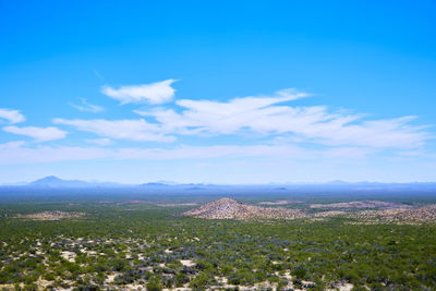 Scenic view of mountains against blue sky