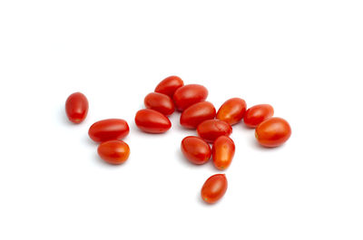 Close-up of tomatoes over white background