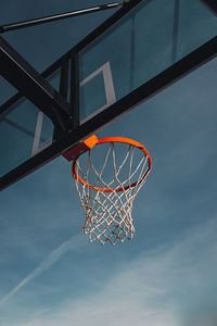 Low angle view of basketball hoop against sky