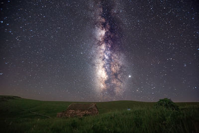 Scenic view of star field against sky at night