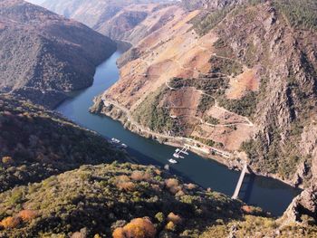 High angle view of river amidst mountains