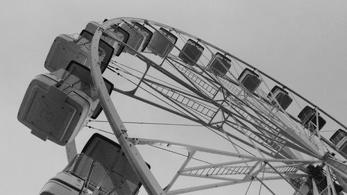 Low angle view of ferris wheel against clear sky