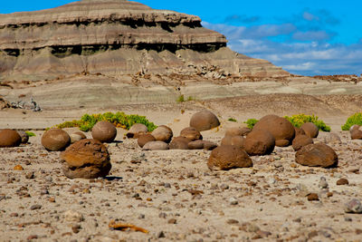 Rocks in desert against sky