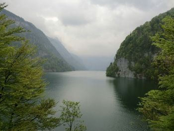 Scenic view of lake against cloudy sky