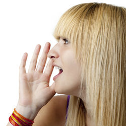 Close-up portrait of a young woman over white background