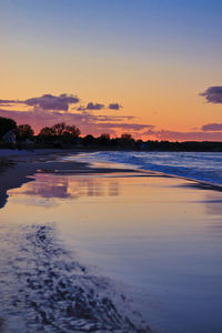 Scenic view of sea against sky at sunset