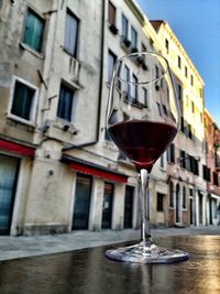 Close-up of wine glass on table in a venice bar