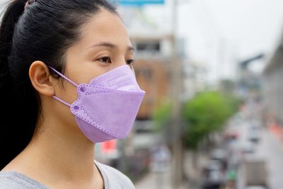 Woman wearing a mask to prevent dust and bacteria