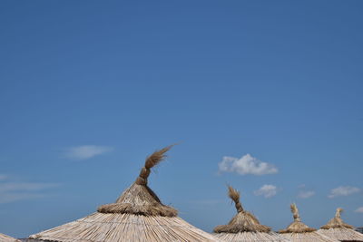 Low angle view of temple against blue sky