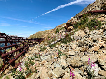 Low angle view of rocky mountain against sky