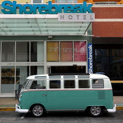 Vintage car on street against buildings in city