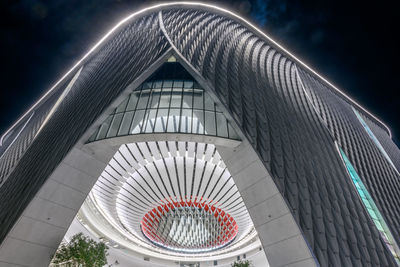 Low angle view of illuminated building against sky