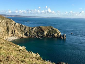 Scenic view of cliff nez de jobourg and sea against sky in normandy 