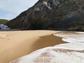 Scenic view of beach against sky