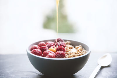 Close-up of fruits in bowl on table