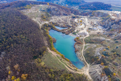 Drone view of industrial opencast mine filled with water. aerial shot of artificial lake