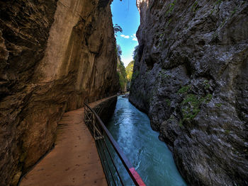 Scenic view of rock formations by sea