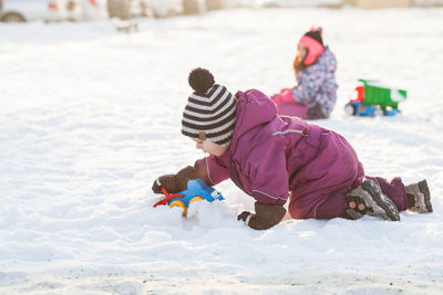 People on snow covered land