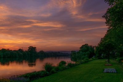 Scenic view of lake against sky during sunset