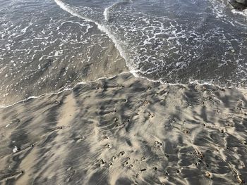 High angle view of surf on beach