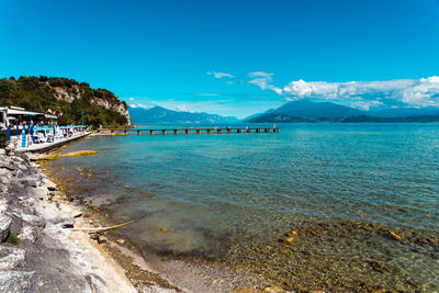 Scenic view of sea against blue sky