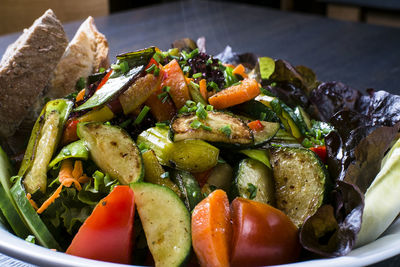 High angle view of chopped vegetables in plate on table