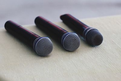 Close-up of microphones on table