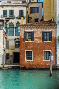 Residential buildings by swimming pool in canal