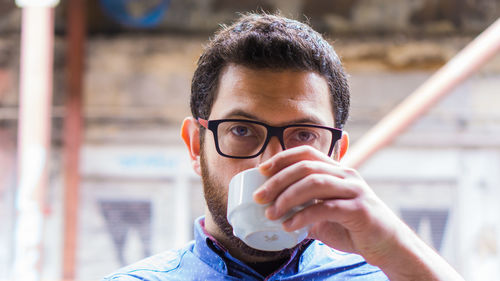 Portrait of man drinking coffee