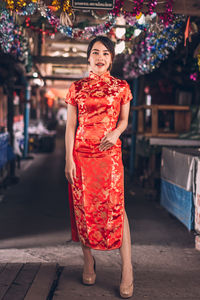 Portrait of a smiling young woman standing outdoors