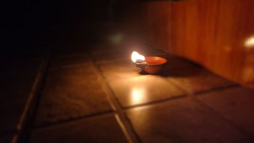 Illuminated lamp on floor