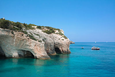 Scenic view of sea against clear blue sky