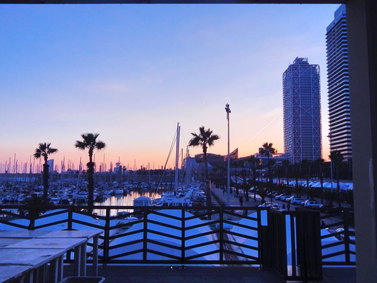 VIEW OF SWIMMING POOL IN CITY AGAINST SKY