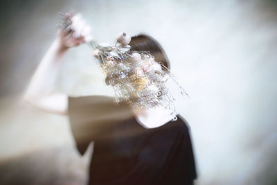 Close-up of woman holding umbrella