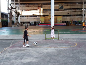 Children playing with football