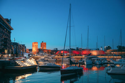 Boats moored at harbor