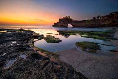 Scenic view of sea against sky during sunset