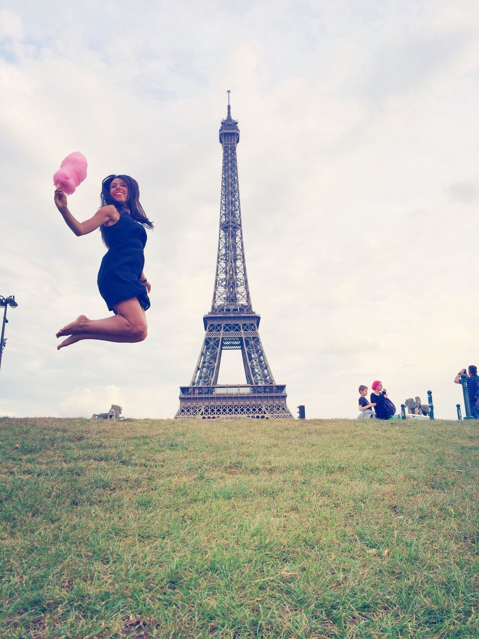 leisure activity, lifestyles, sky, tourism, large group of people, famous place, travel destinations, built structure, men, grass, person, international landmark, architecture, tower, eiffel tower, travel, capital cities, tall - high, tree