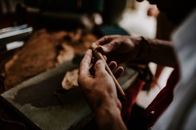 Midsection of woman preparing food in kitchen