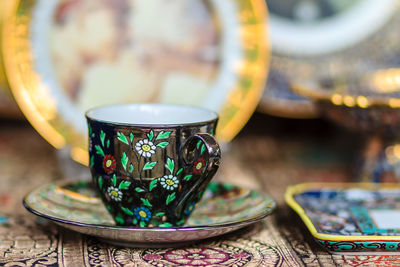 Close-up of multi colored glass on table