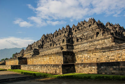 View of temple against cloudy sky