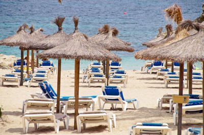 Lounge chairs and parasols on beach
